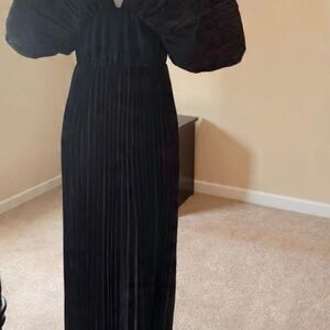 Elegant Black Pleated Maxi Dress with Statement Sleeves